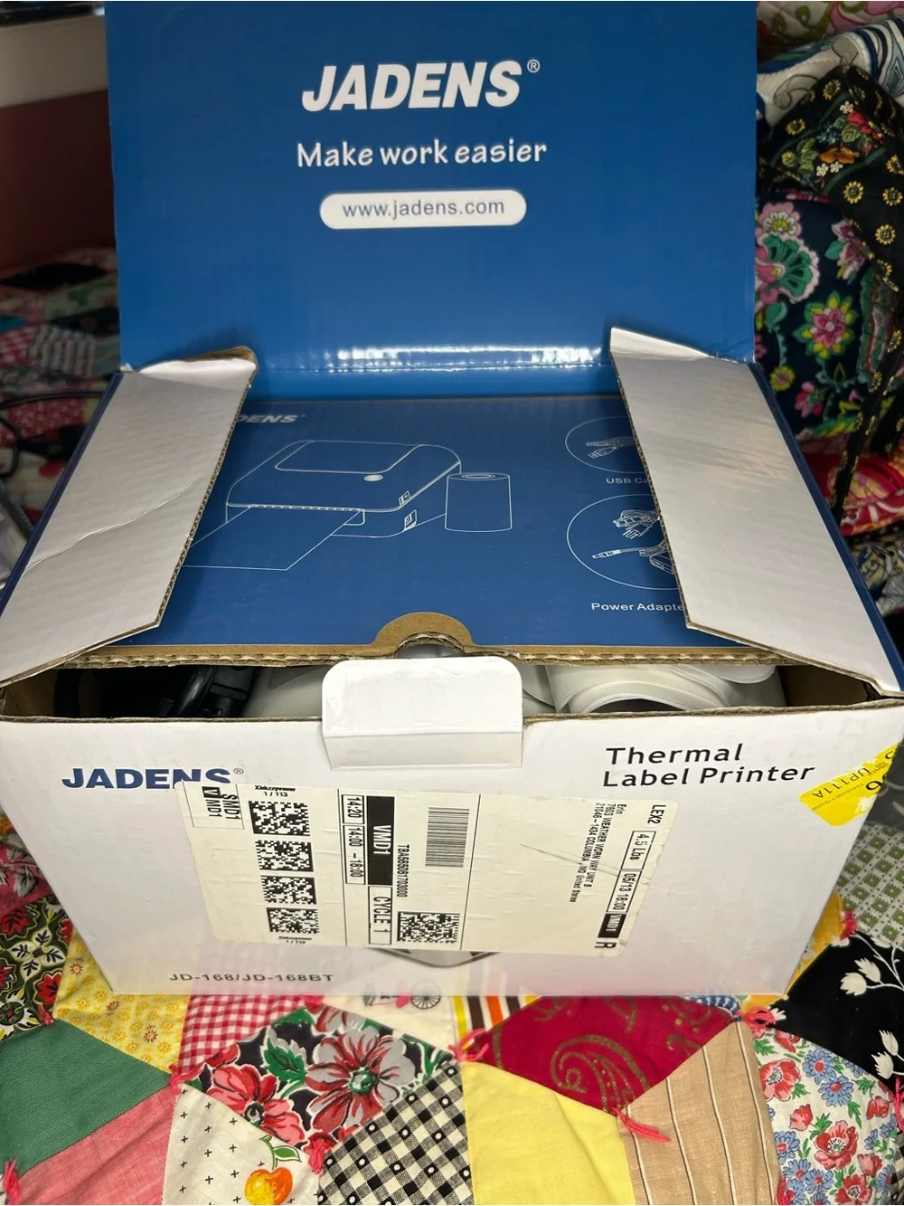 Jade White Compact Device with Black Screen and Blue Button